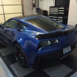 A Blue and Black (Not White and Gold) Corvette Z06 that Complements The Dress