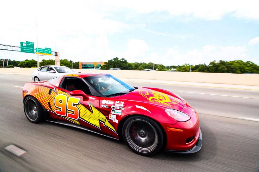 The Lightning McQueen Corvette on the road.