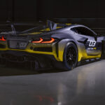 Rear 3/4 view of 2024 Chevrolet Corvette Z06 GT3.R parked in a race car garage. Pre-production model shown. Actual production model may vary. Model year 2024 Corvette Z06 GT3.R will be available later this year.