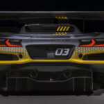 Rear view of 2024 Chevrolet Corvette Z06 GT3.R in spotlight. Pre-production model shown. Actual production model may vary. Model year 2024 Corvette Z06 GT3.R will be available later this year.