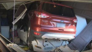 Ford Escape Crashes Into Garage Crushes C4 Corvette